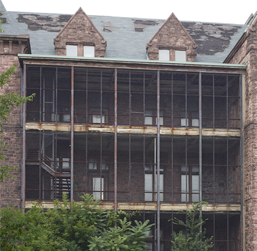 Fenced-in walkways of the Richardson Olmsted Complex, the 1870 Buffalo State Asylum for the Insane, Buffalo, New York. Photograph by Carol M. Highsmith, 2018.